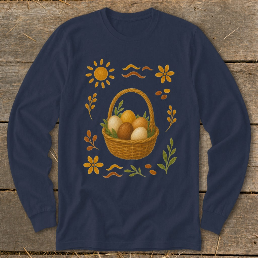 Long sleeve navy shirt with a woven basket of brown and white eggs surrounded by floral and sun motifs.