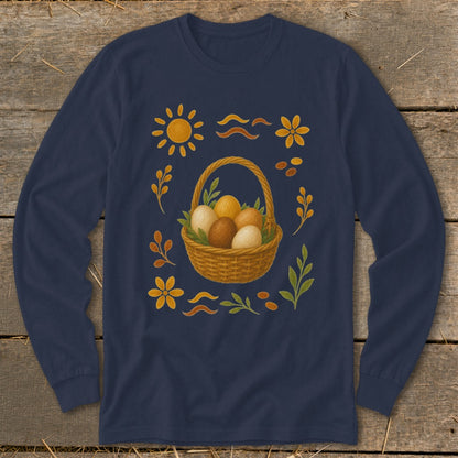 Long sleeve navy shirt with a woven basket of brown and white eggs surrounded by floral and sun motifs.