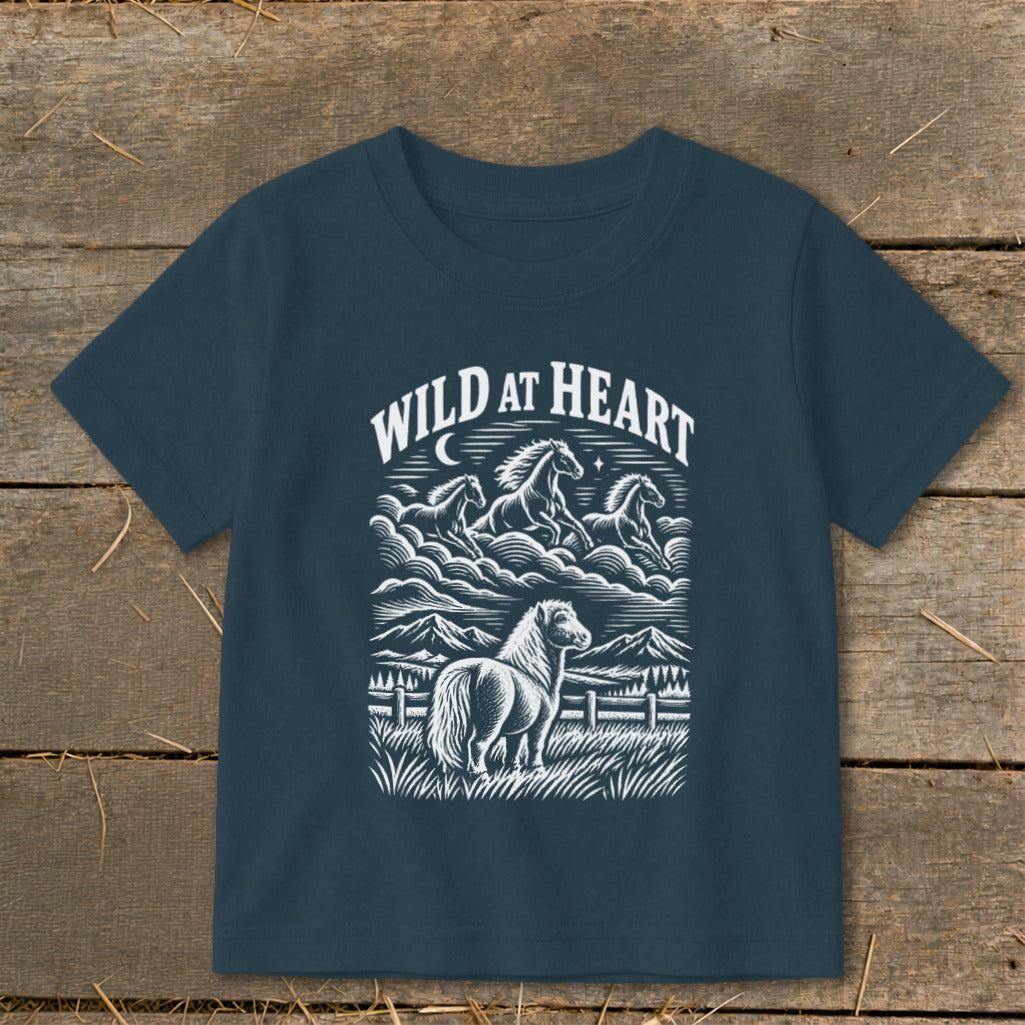 Navy t-shirt with "Wild at Heart" and a graphic of horses running in clouds over mountains.