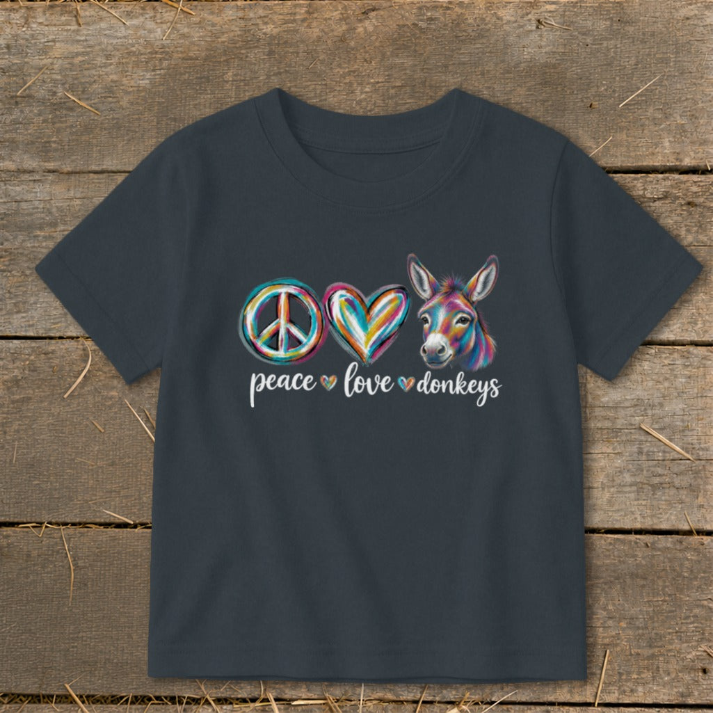 Dark t-shirt with "peace love donkeys" text and colorful peace sign, heart, and donkey.