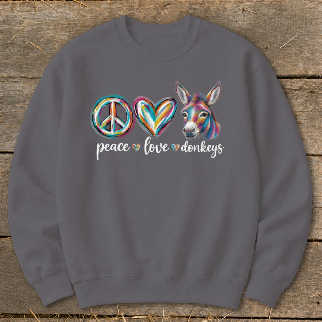 Crewneck sweatshirt with colorful peace sign, heart, and donkey graphic with text.