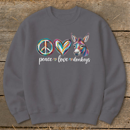 Crewneck sweatshirt with colorful peace sign, heart, and donkey graphic with text.