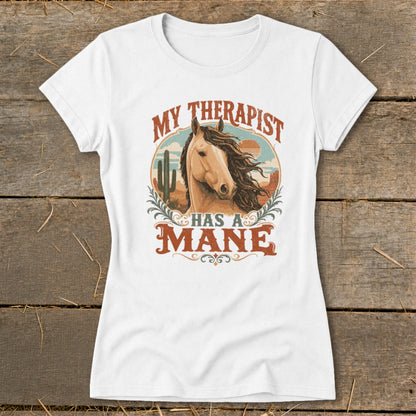 White t-shirt with a horse and desert graphic reading "My Therapist Has A Mane".