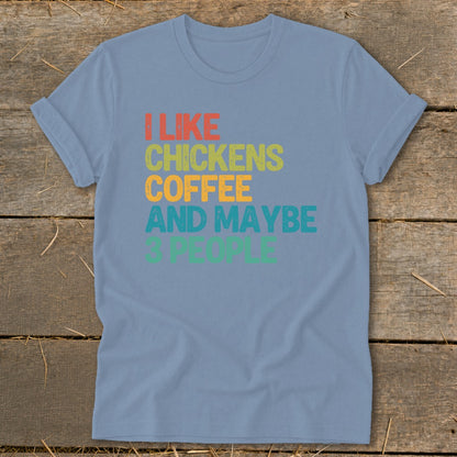 Light blue t-shirt with text: I LIKE CHICKENS COFFEE AND MAYBE 3 PEOPLE.