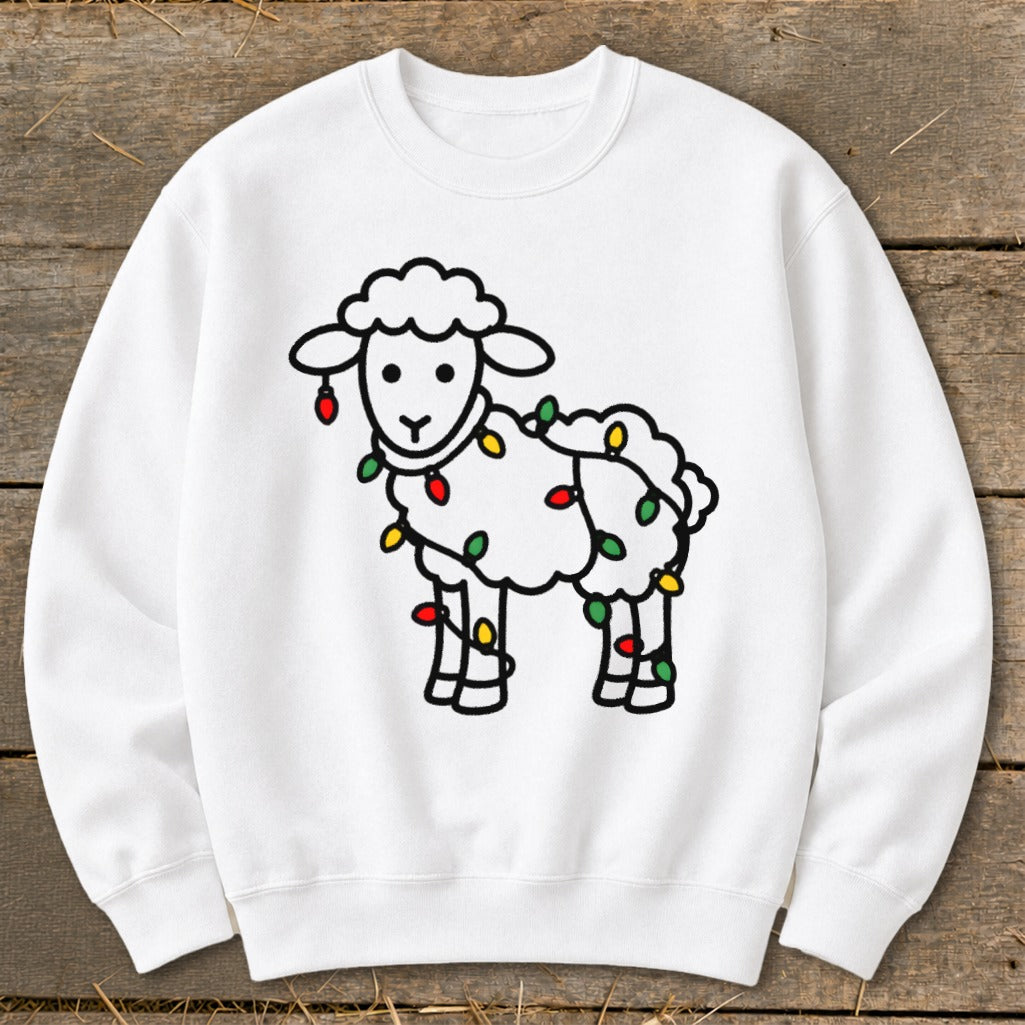 A white crewneck sweatshirt features a cartoon sheep wrapped in colorful Christmas lights.