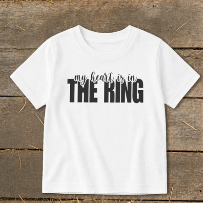 White t-shirt with black text that reads "my heart is in THE RING".