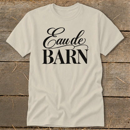 Cream t-shirt with "Eau de BARN" text in black script and block letters.
