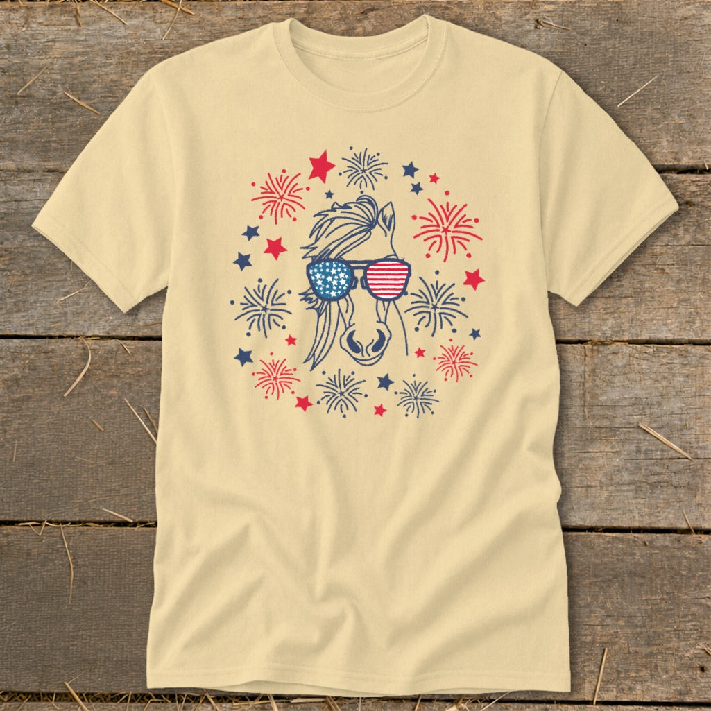 Horse wearing American flag sunglasses with fireworks and stars.
