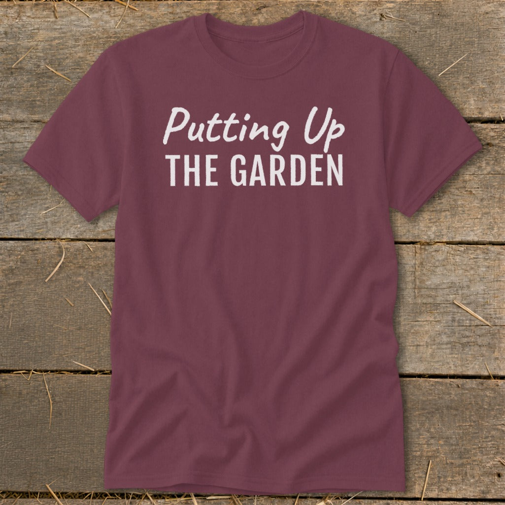 Maroon t-shirt with white text "Putting Up THE GARDEN".