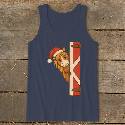 Horse wearing Santa hat peeking around a red and white barn door.