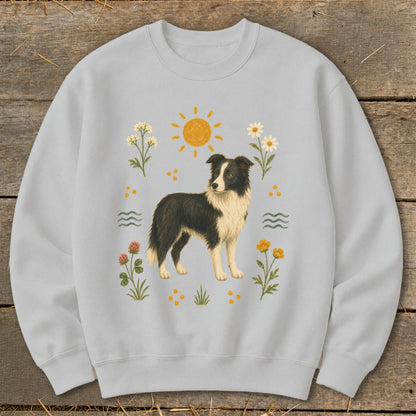 Light gray sweatshirt with a vintage-style Border Collie surrounded by flowers, sun, and waves.