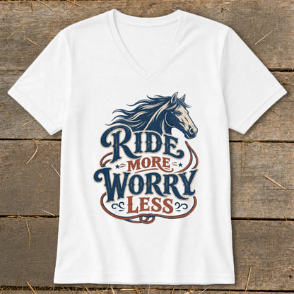 White v-neck t-shirt with dark blue horse graphic and text "RIDE MORE WORRY LESS".