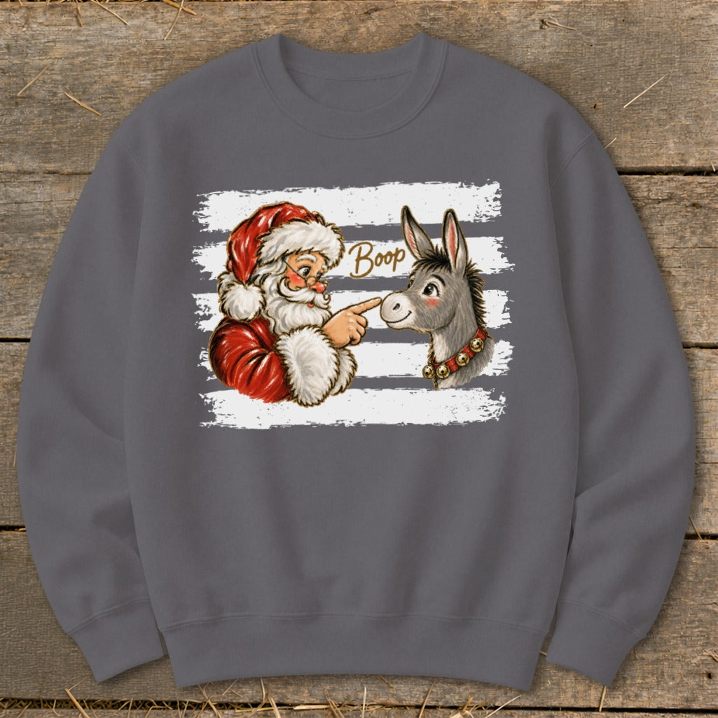 Santa Claus booping a donkey with the word "Boop" written above.