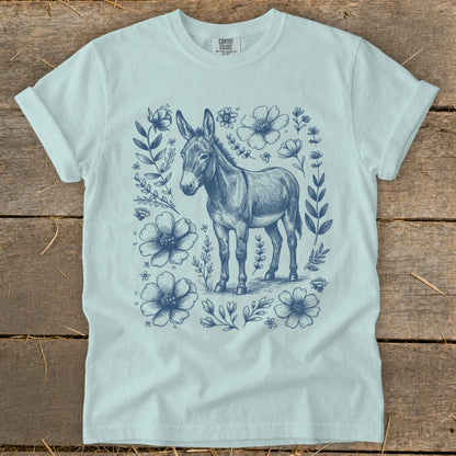 Light blue t-shirt with a blue donkey and floral sketch design.