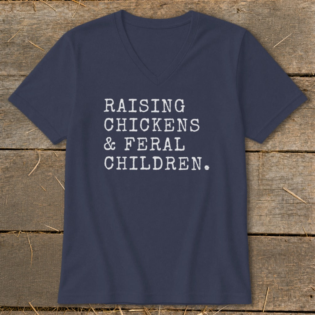 Navy v-neck t-shirt with white text reading "RAISING CHICKENS & FERAL CHILDREN."