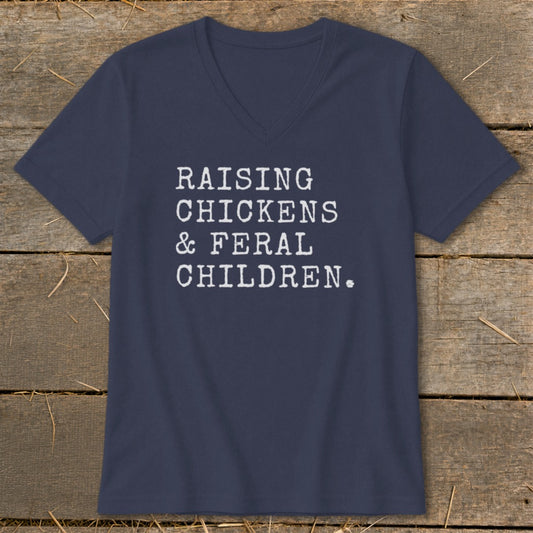 Navy v-neck t-shirt with white text reading "RAISING CHICKENS & FERAL CHILDREN."