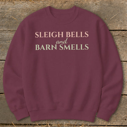 Maroon sweatshirt with "Sleigh Bells and Barn Smells" text in light pink and cream.