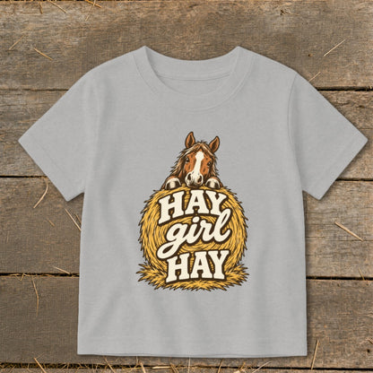 Grey t-shirt with a horse peeking over a hay bale with text "HAY girl HAY".