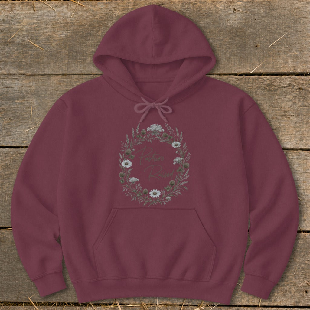 Maroon hoodie with floral wreath graphic containing text "Posture Raised".
