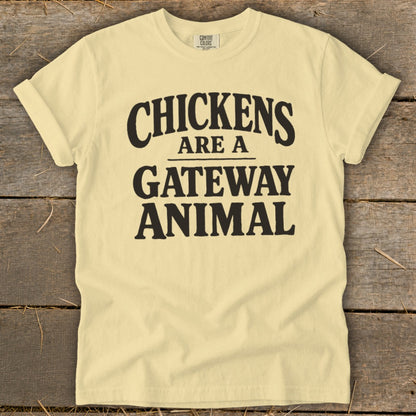 Light yellow t-shirt with black text reading "CHICKENS ARE A GATEWAY ANIMAL."