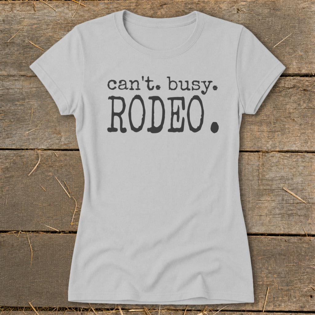 Light grey t-shirt with "can't. busy. RODEO." text on front.