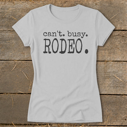 Light grey t-shirt with "can't. busy. RODEO." text on front.