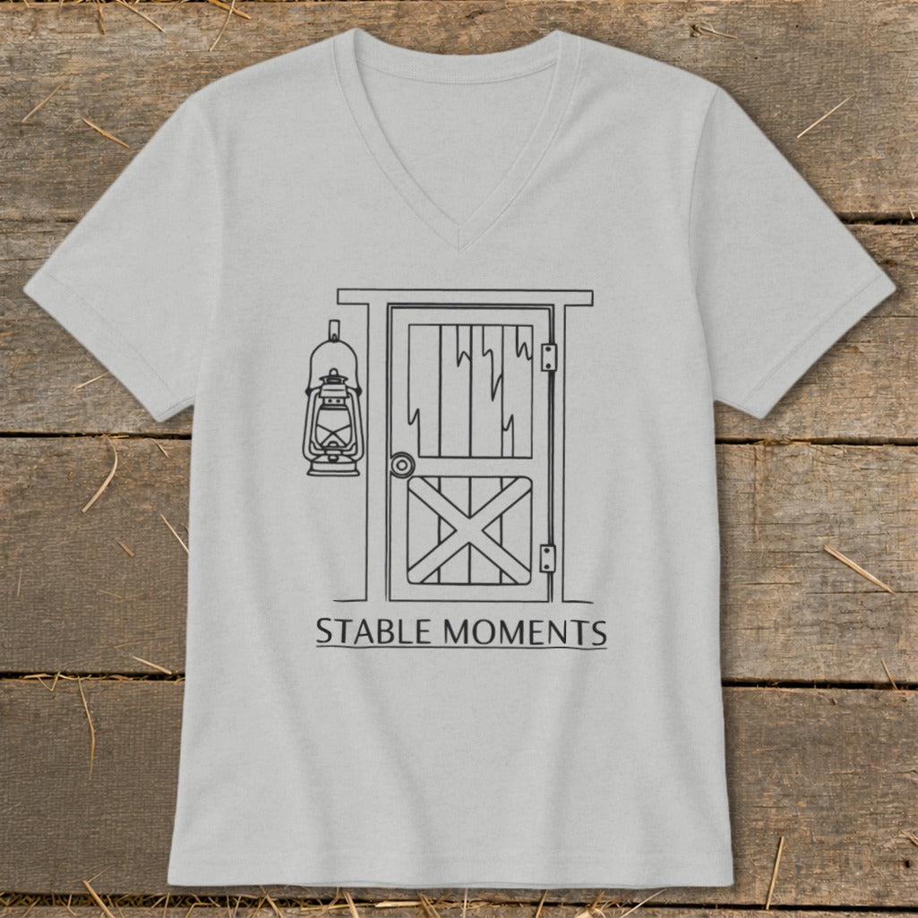 Light gray v-neck t-shirt with line art of a barn door and lantern, text "STABLE MOMENTS".