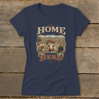 "Home Is Where The Herd Is" graphic on a navy blue t-shirt with a pastoral farm scene.