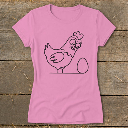 Pink t-shirt with a black line drawing of a cartoon chicken next to an egg.