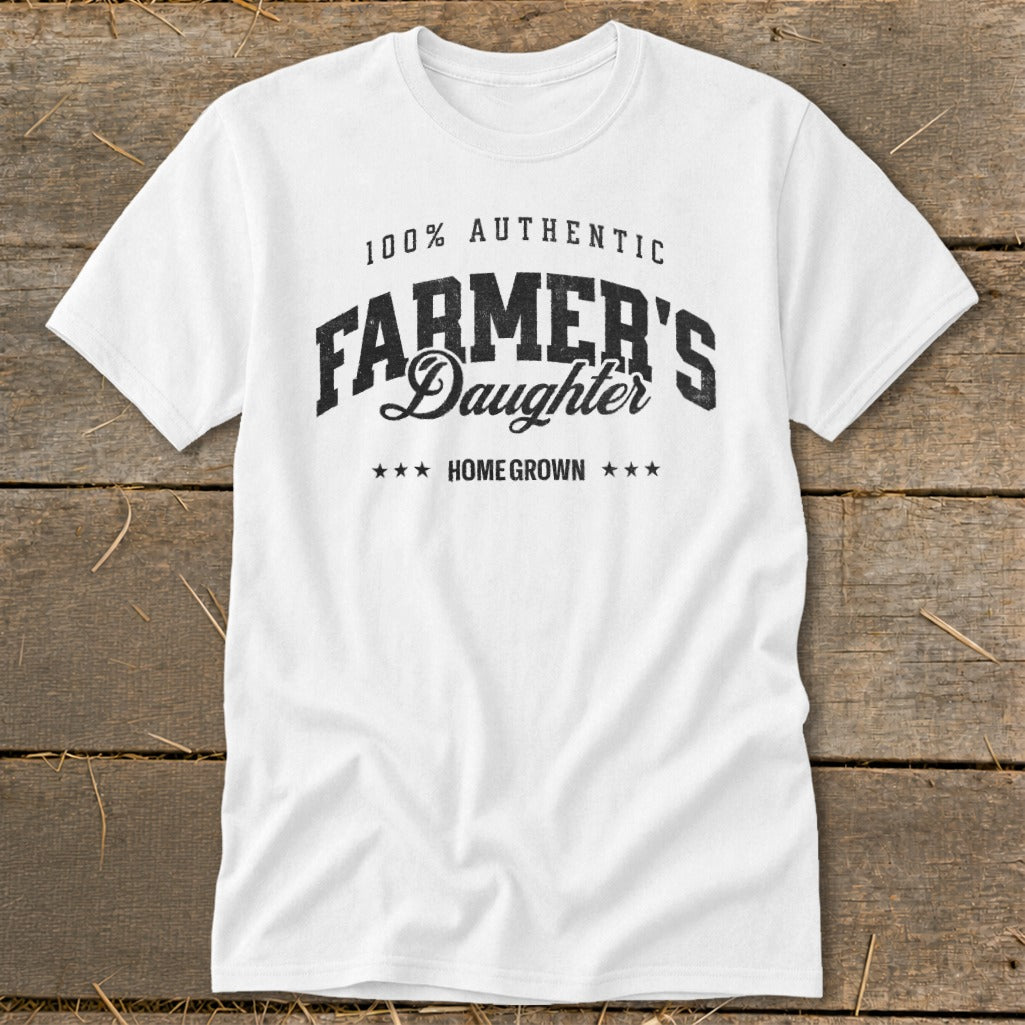 White t-shirt with "100% AUTHENTIC FARMER'S Daughter HOME GROWN" text.