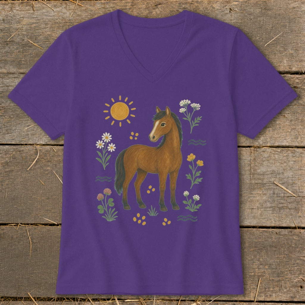 Purple t-shirt with a brown horse surrounded by a sun, flowers, and clover.