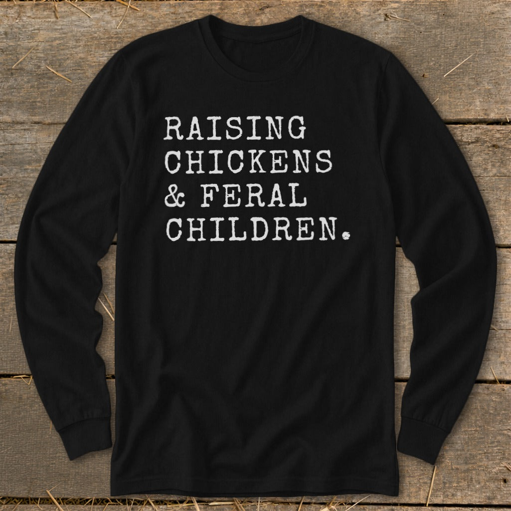 Black long-sleeve shirt with white text: "RAISING CHICKENS & FERAL CHILDREN."