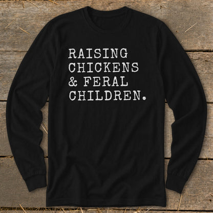 Black long-sleeve shirt with white text: "RAISING CHICKENS & FERAL CHILDREN."