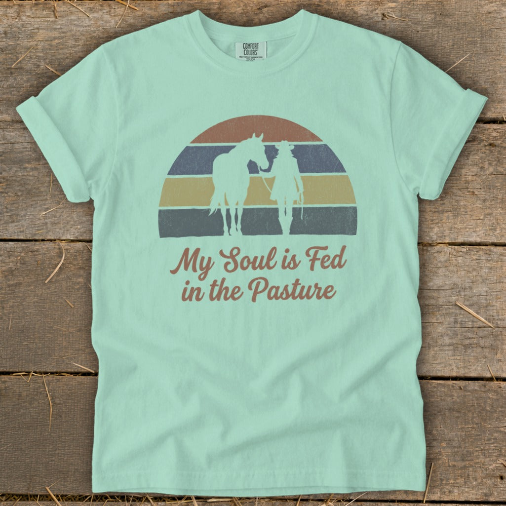 Mint green t-shirt with horse and rider silhouette and "My Soul is Fed in the Pasture".