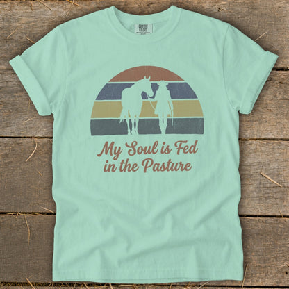Mint green t-shirt with horse and rider silhouette and "My Soul is Fed in the Pasture".