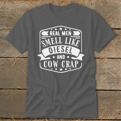 Gray t-shirt with white text "REAL MEN SMELL LIKE DIESEL AND COW CRAP".