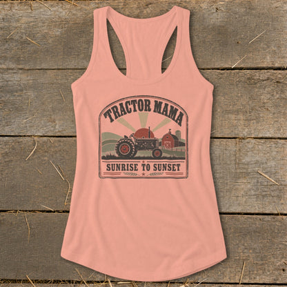 Peach tank top with a graphic featuring a tractor, barn, and the text "Tractor Mama Sunrise to Sunset".