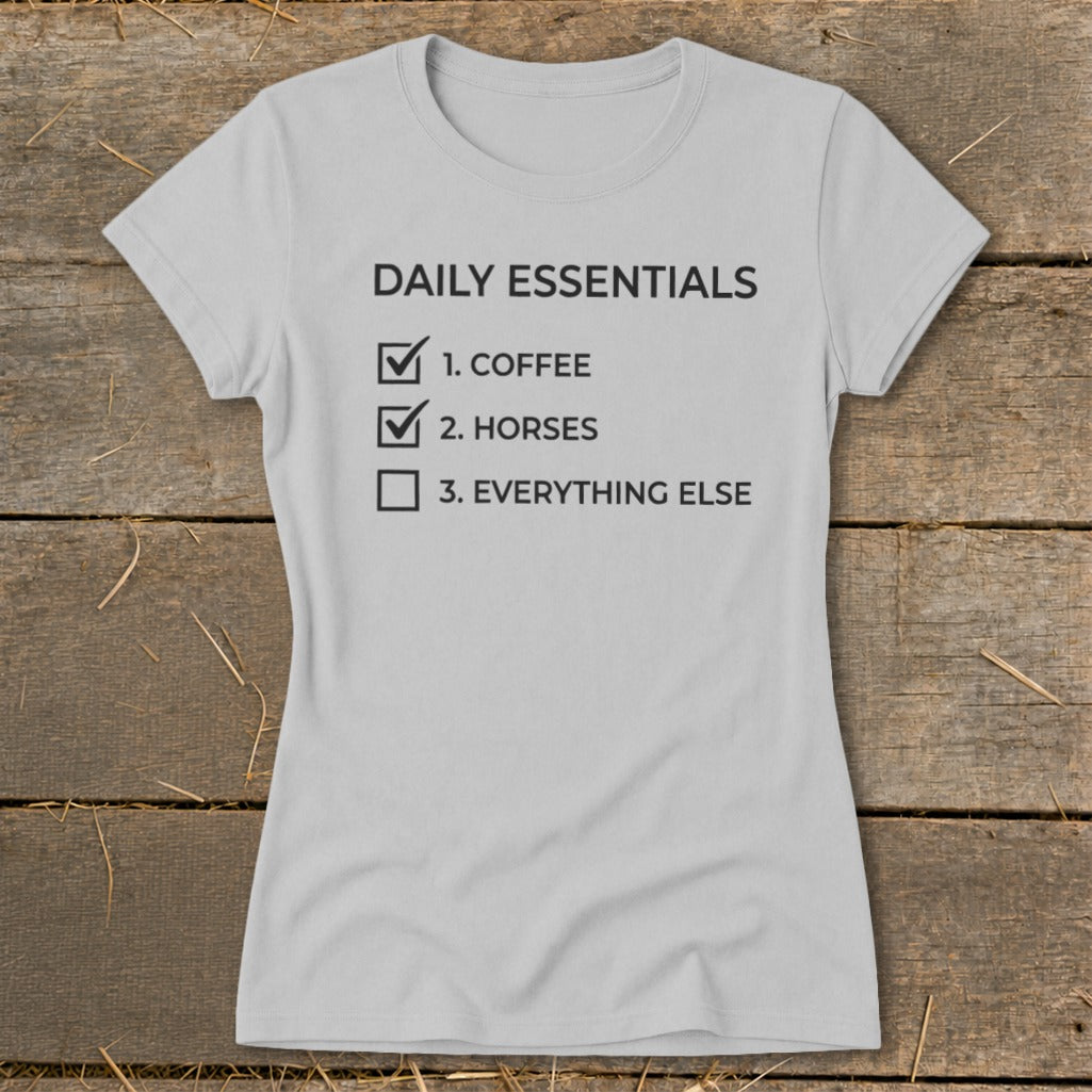 Grey t-shirt with "Daily Essentials" and a checklist including coffee and horses.