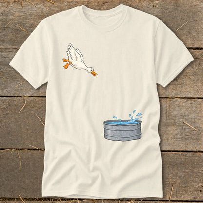T-shirt graphic of a white goose jumping into a water-filled trough.