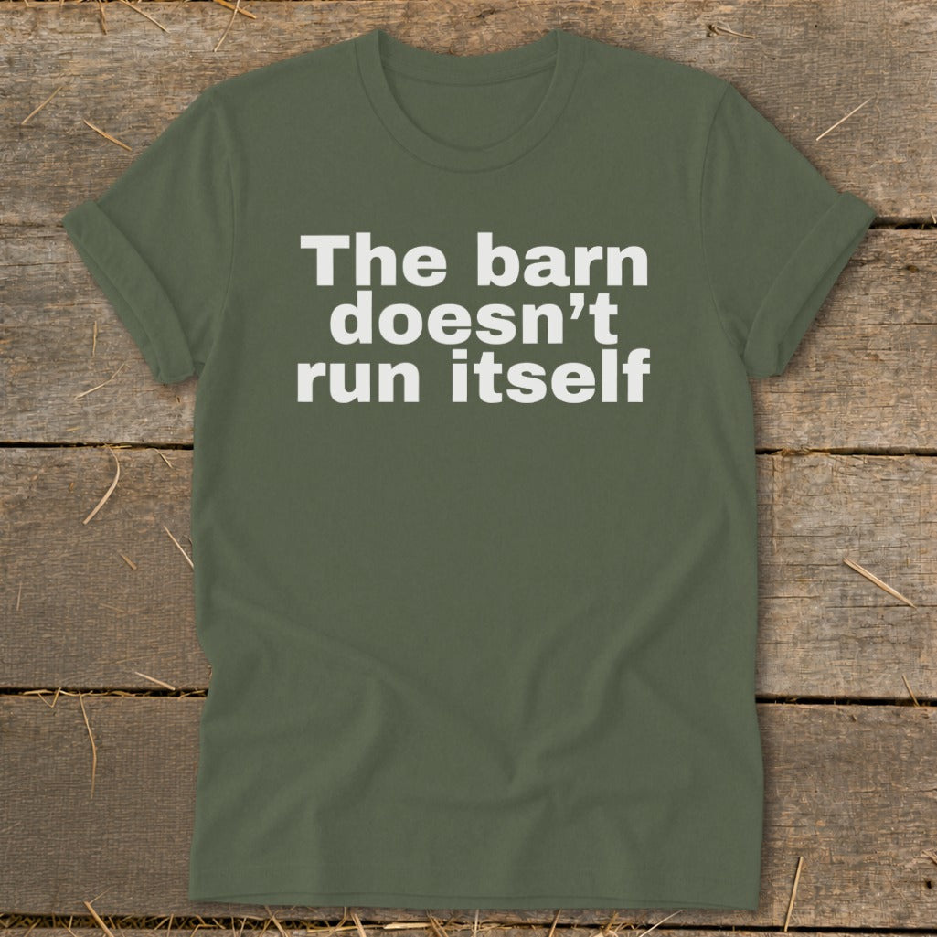 Green t-shirt with white text reading "The barn doesn't run itself".