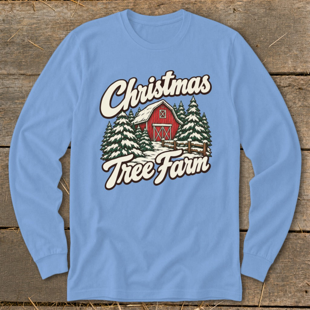 Light blue long-sleeve shirt with "Christmas Tree Farm" graphic of a red barn and snowy trees.