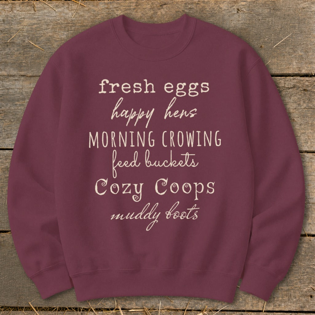 Maroon sweatshirt with white text listing farm-related phrases.