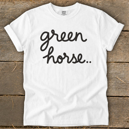 White t-shirt with black cursive text "green horse..".