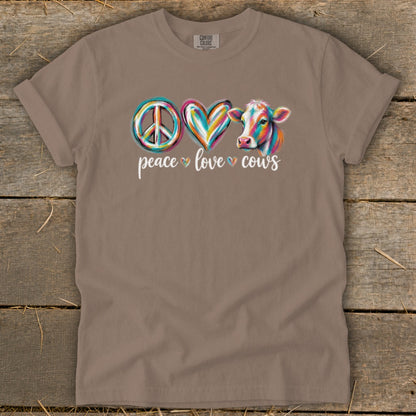 Brown t-shirt with peace, heart, and cow graphic and text "peace love cows".