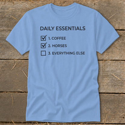 Light blue t-shirt with "Daily Essentials" checklist: Coffee, Horses, Everything Else.