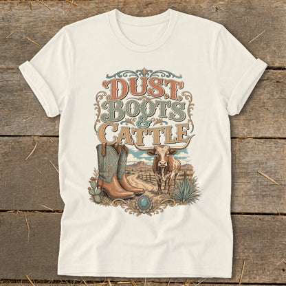 White t-shirt with "Dust Boots & Cattle" graphic, cowboys boots, and steer.