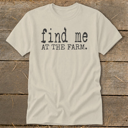 Light beige t-shirt with black text that reads "find me AT THE FARM."