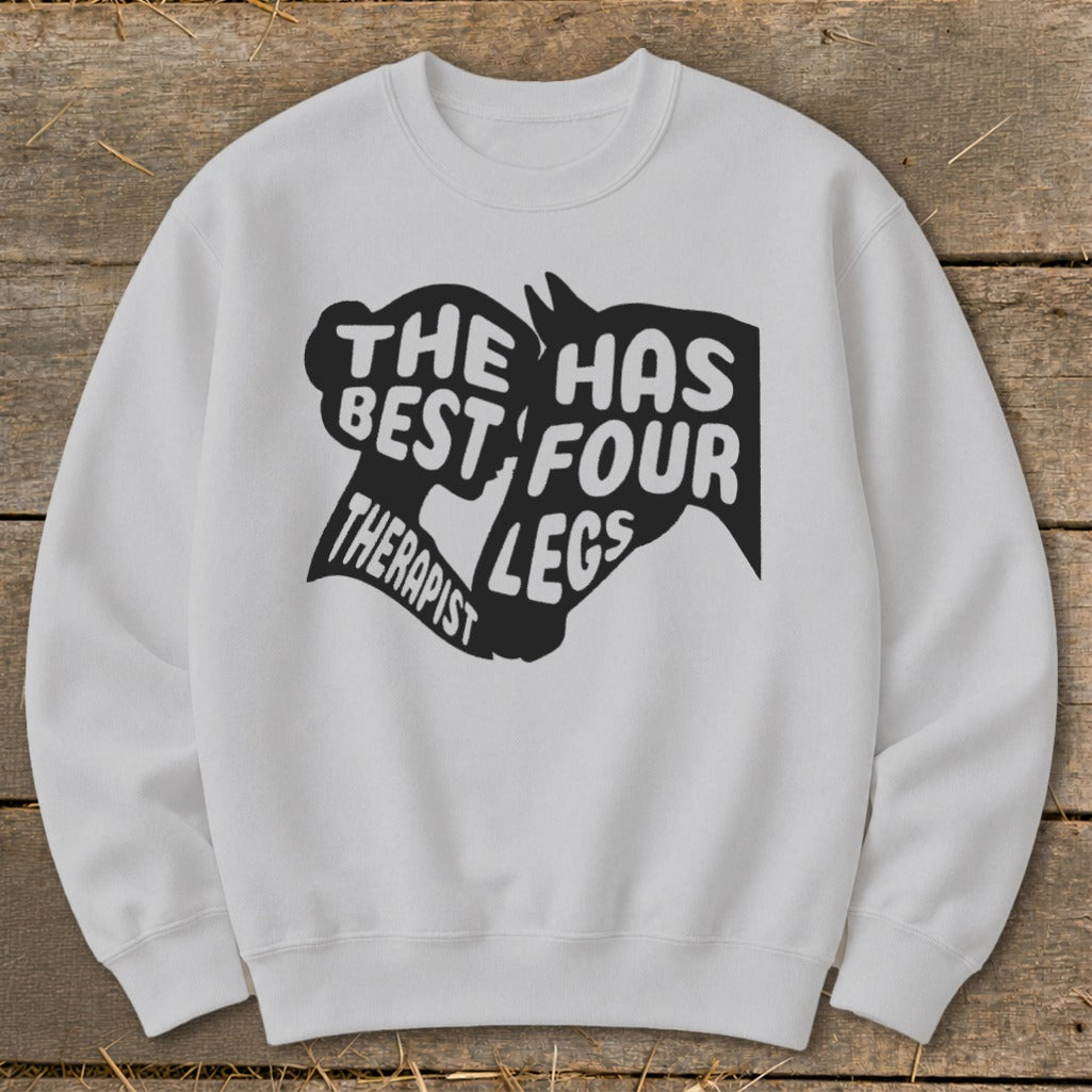 White sweatshirt with a black graphic that reads "The best therapist has four legs."