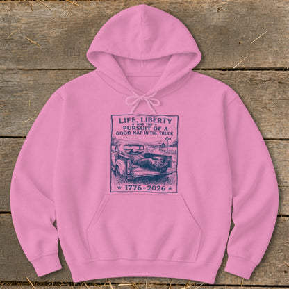 Pink hoodie with "Life, Liberty and the Pursuit of a Good Nap in the Truck 1776-2026" text.