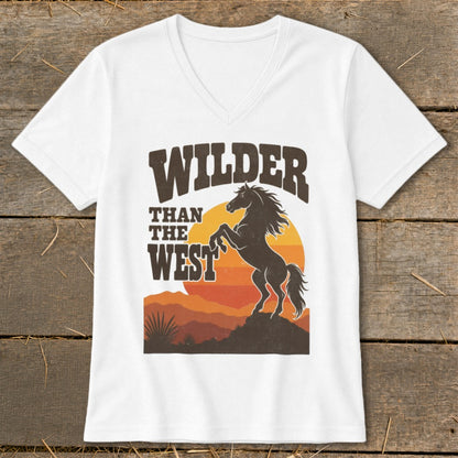 White t-shirt graphic with text "WILDER THAN THE WEST" and a rearing horse.